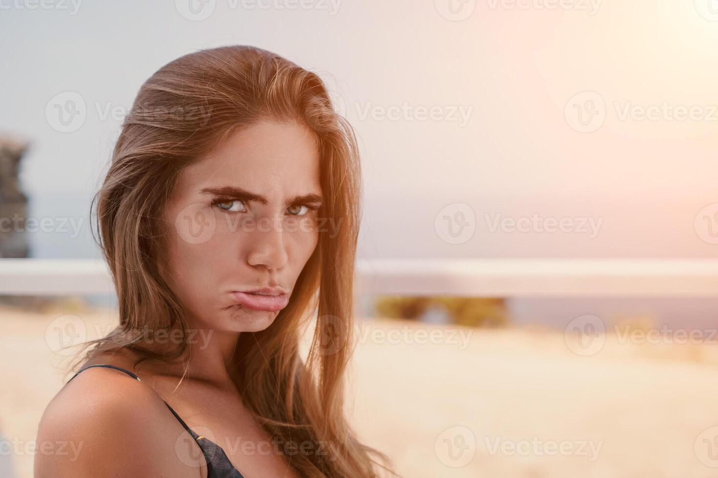 Happy woman portrait in cafe. Boho chic fashion style. Outdoor photo of young happy woman with long hair, sunny weather outdoors sitting in modern cafe.