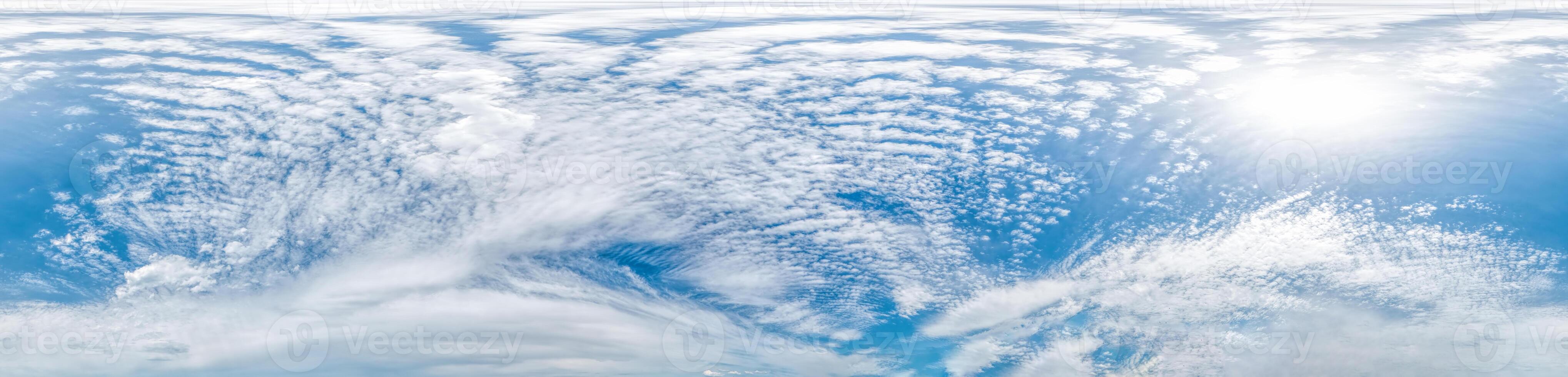 Blue sky with light clouds Seamless panorama in spherical equirectangular format with complete zenith for use in 3D graphics, game and for composites in aerial drone 360 degree panoramas as a sky dome photo