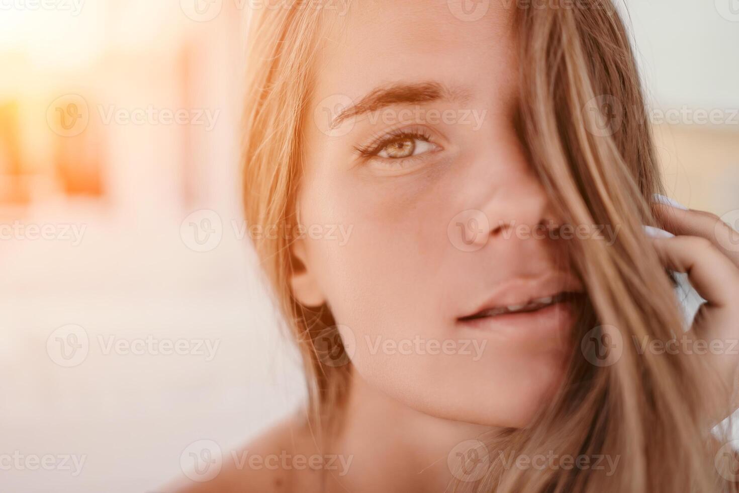 Happy woman portrait in cafe. Boho chic fashion style. Outdoor photo of young happy woman with long hair, sunny weather outdoors sitting in modern cafe.