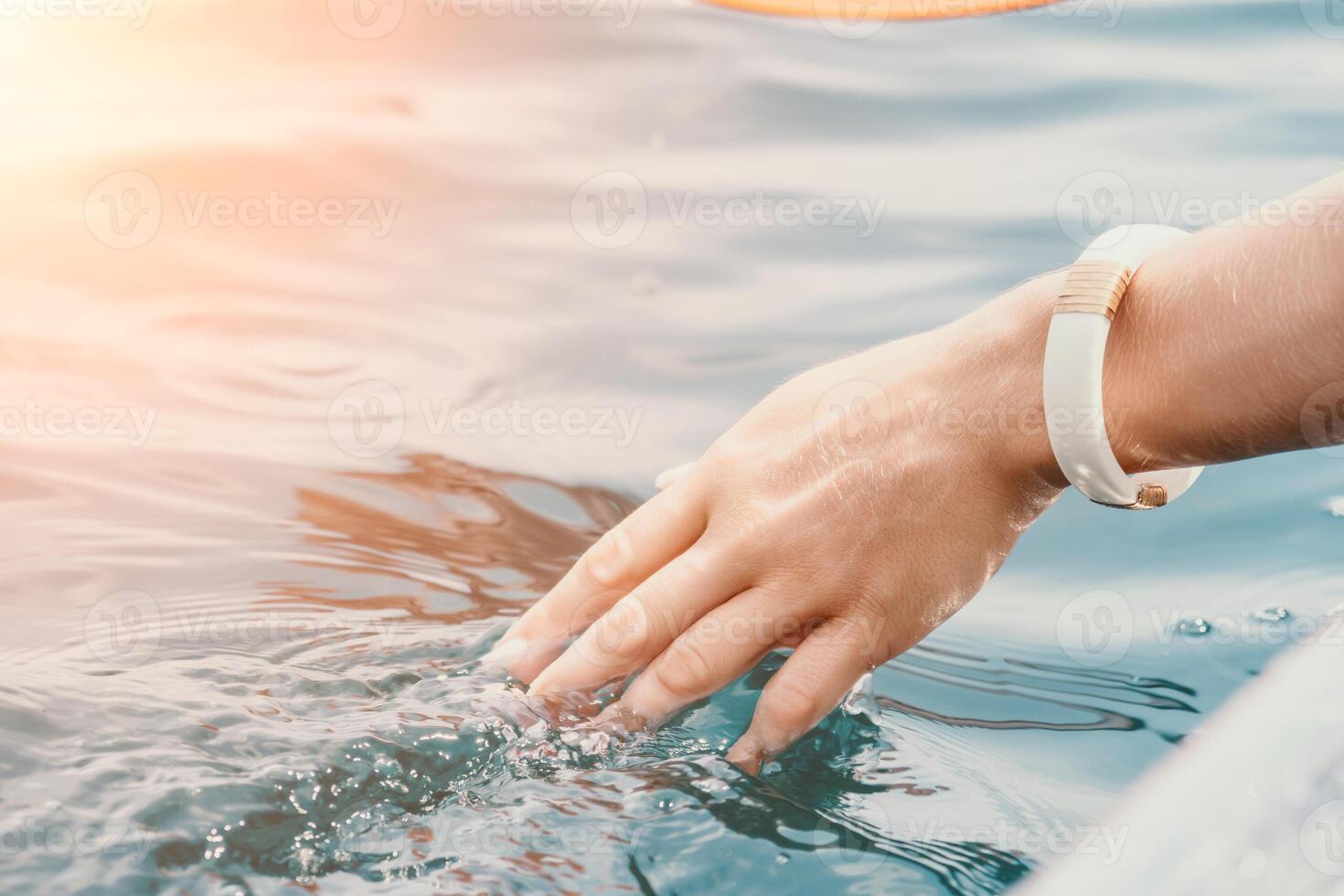 Woman in kayak back view. Happy young woman with long hair floating in transparent kayak on the crystal clear sea. Summer holiday vacation and cheerful female people relaxing having fun on the boat photo