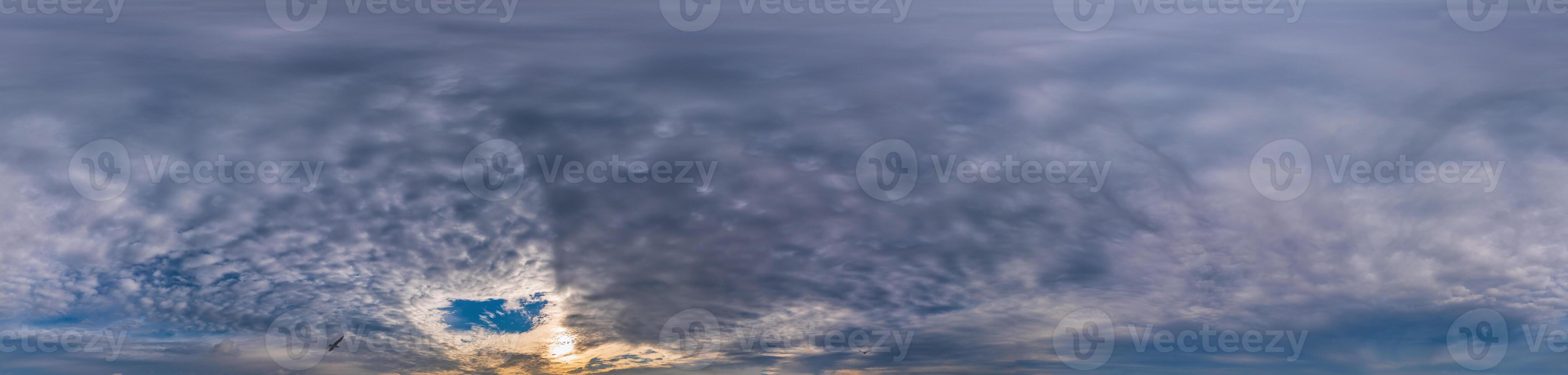 Sunset sky panorama with Stratocumulus clouds in Seamless spherical equirectangular format. Full zenith for use in 3D graphics, game and editing aerial drone 360 degree panoramas for sky replacement. photo