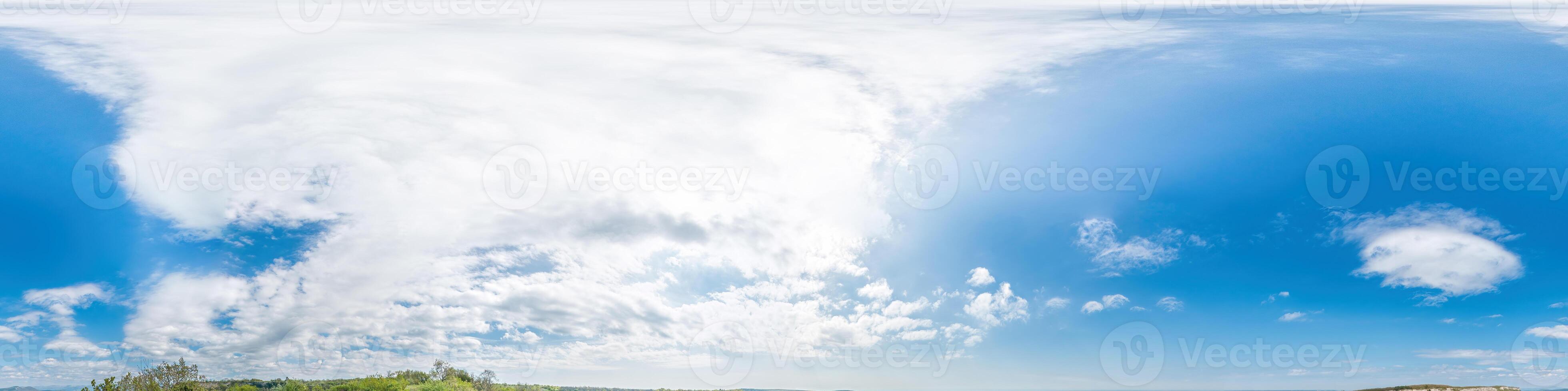 Seamless panorama of sky with light clouds in spherical equirectangular format with complete zenith for use in 3D graphics, game and for composites in aerial drone 360 degree panoramas as a sky dome. photo