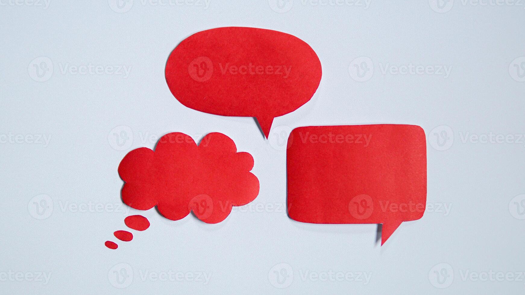 Red paper speech bubble on white background. Blank space that can be added text. photo