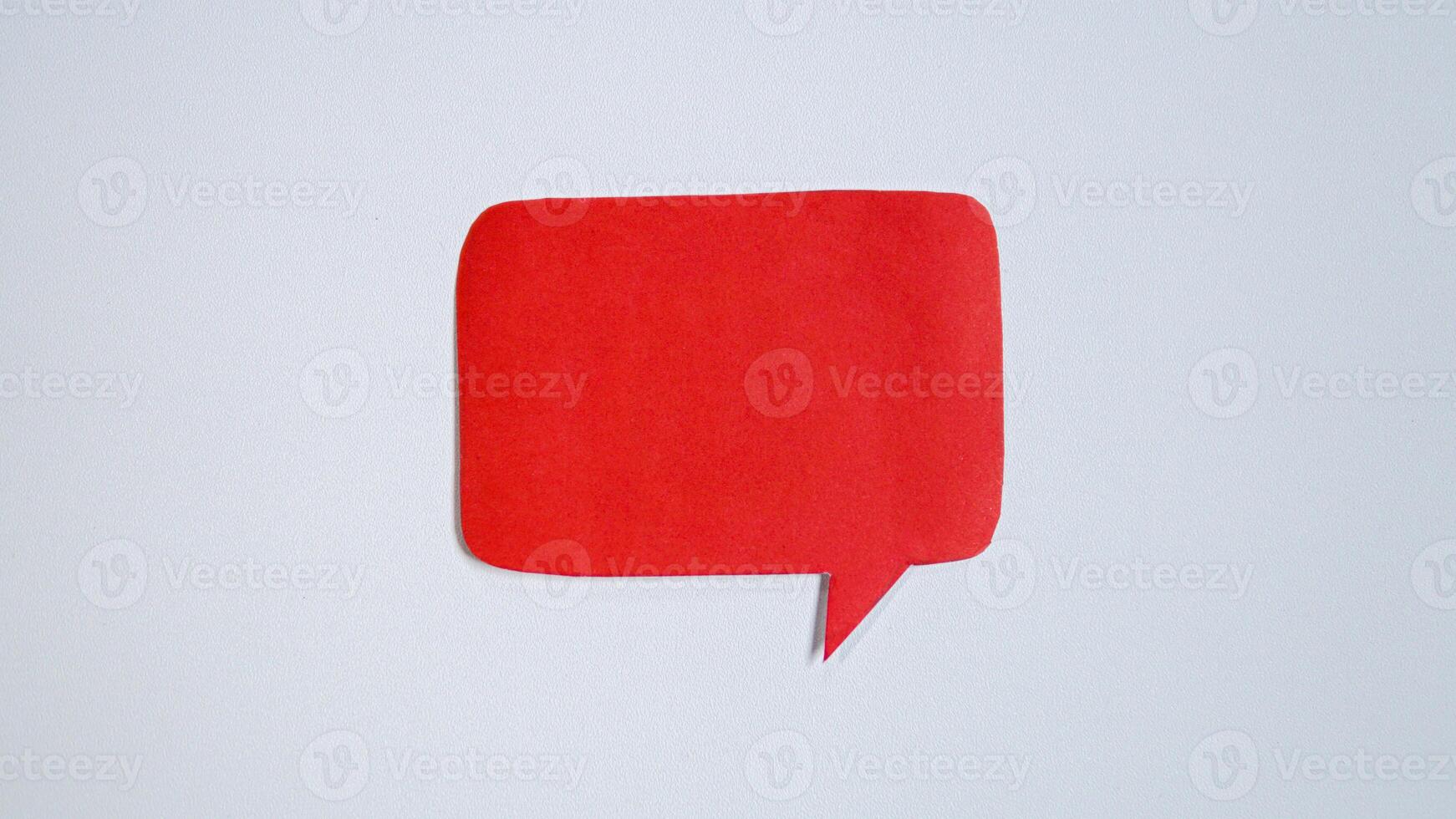 Red paper speech bubble on white background. Blank space that can be added text. photo