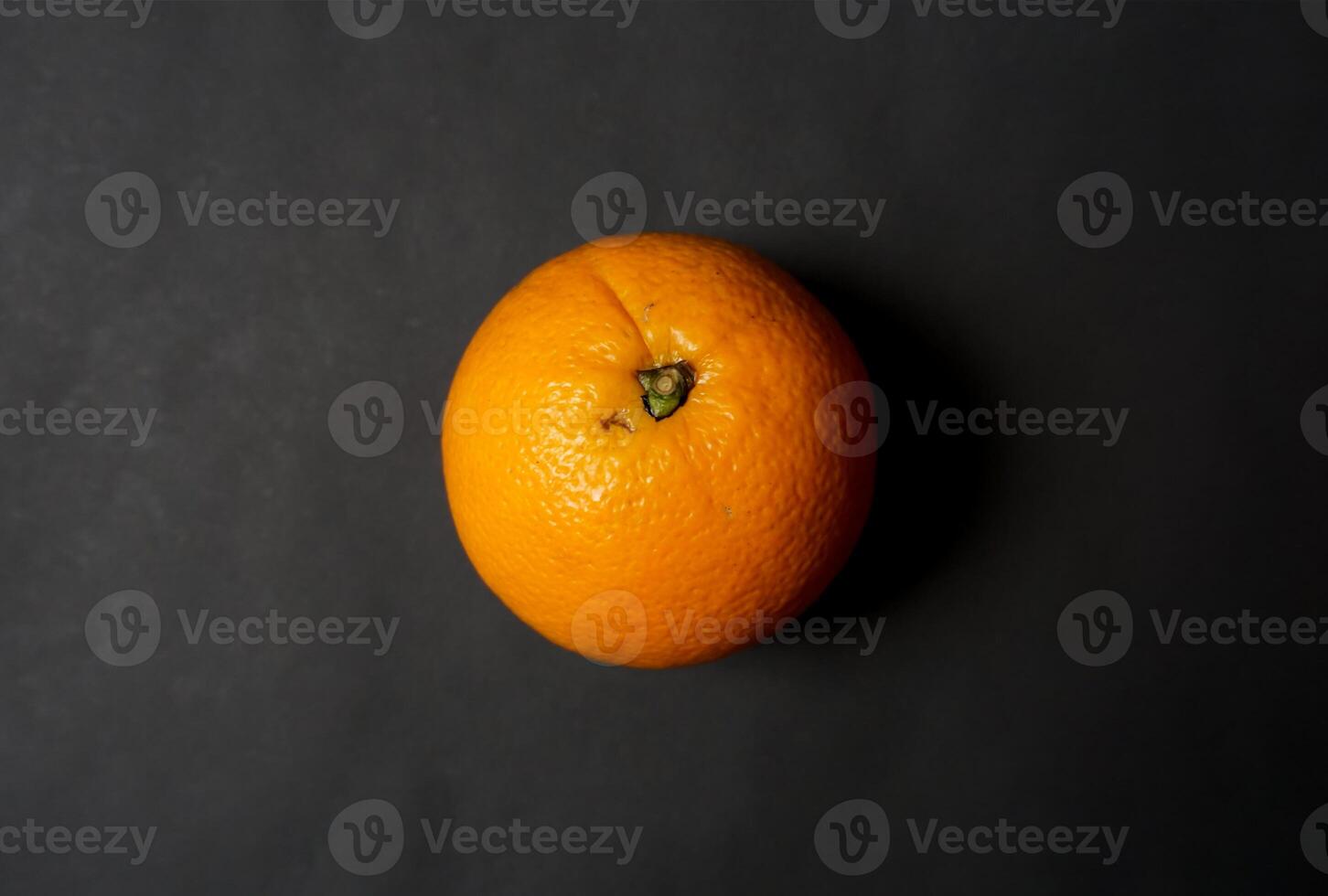 Fresh orange on black background photo