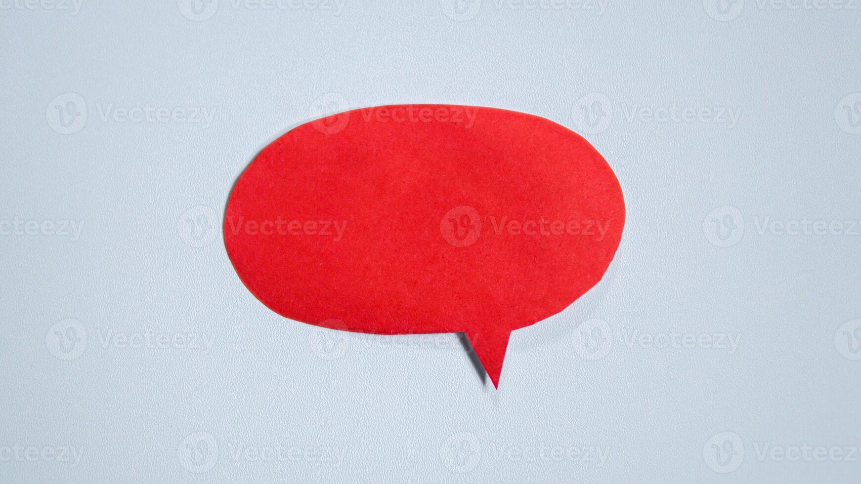 Red paper speech bubble on white background. Blank space that can be added text. photo