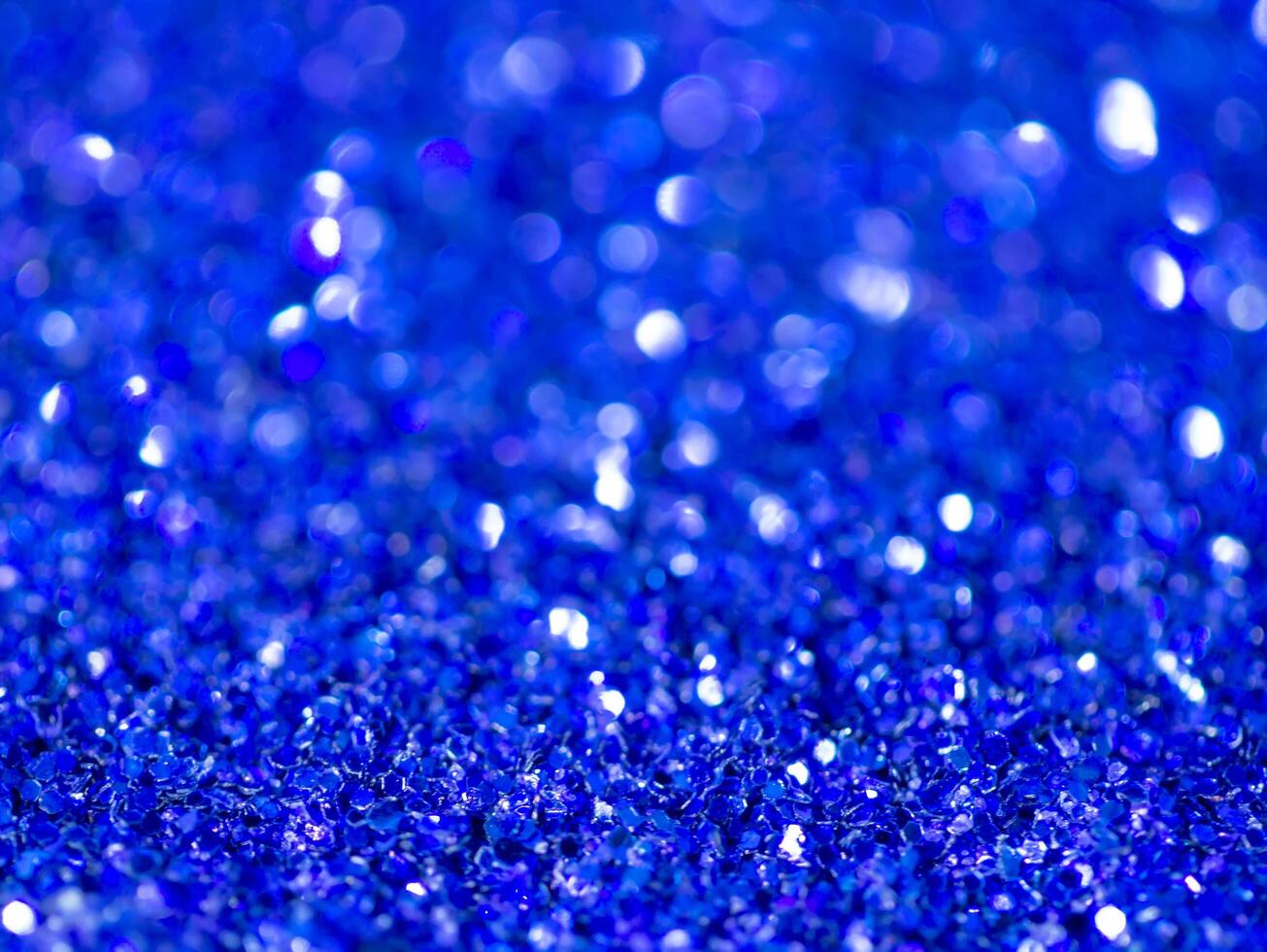 Blue sparkling glitter bokeh background. photo