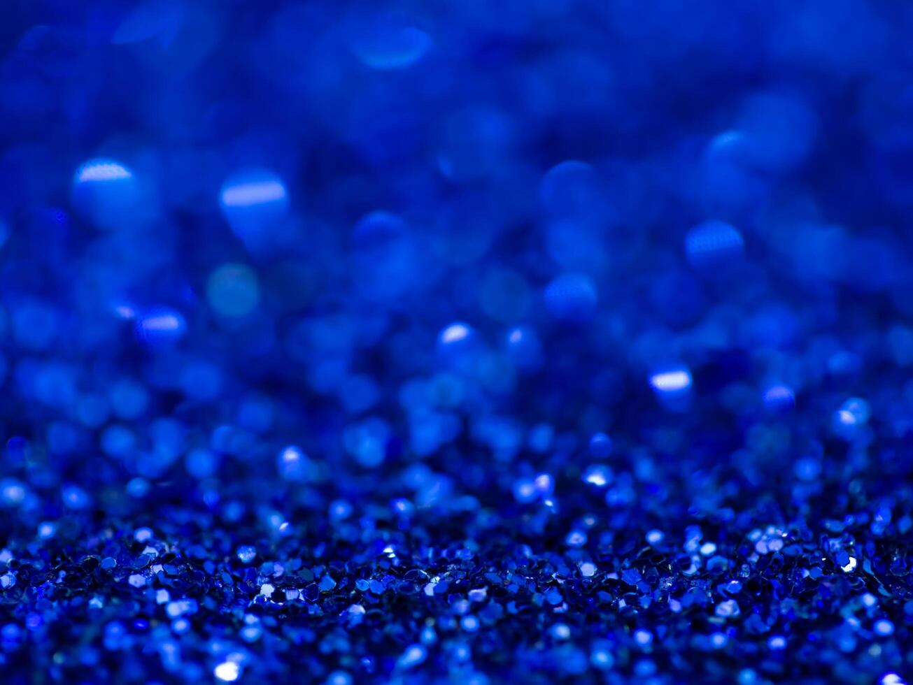 Blue sparkling glitter bokeh background. photo
