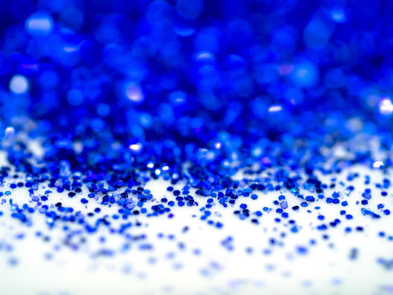 Blue sparkling glitter bokeh background. photo