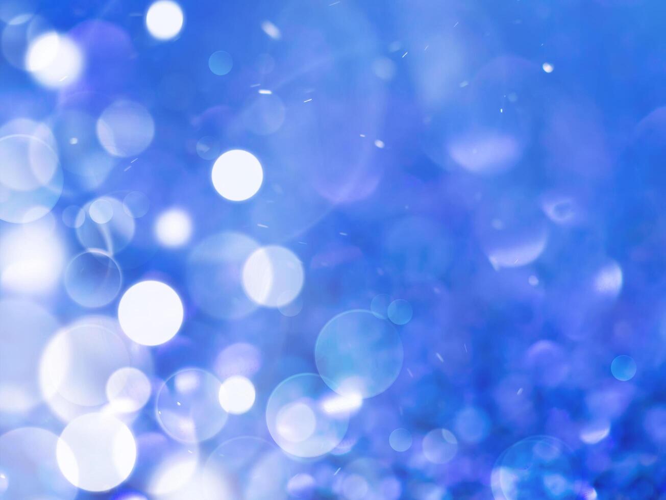 Blue sparkling glitter bokeh background. photo
