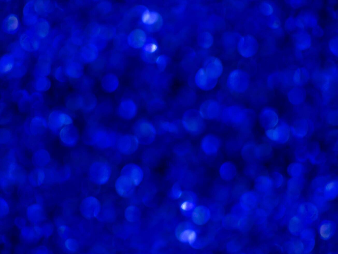 Blue sparkling glitter bokeh background. photo