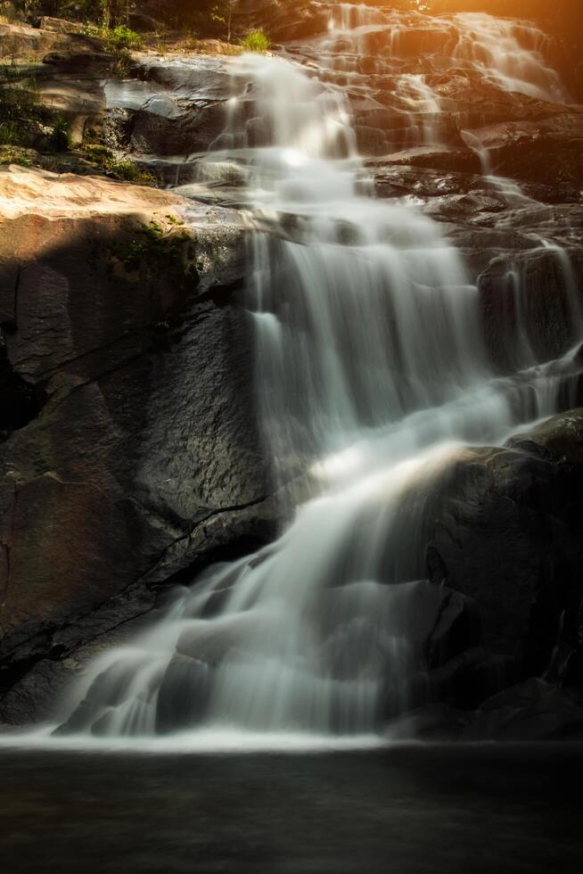 Small waterfall in the forest photo