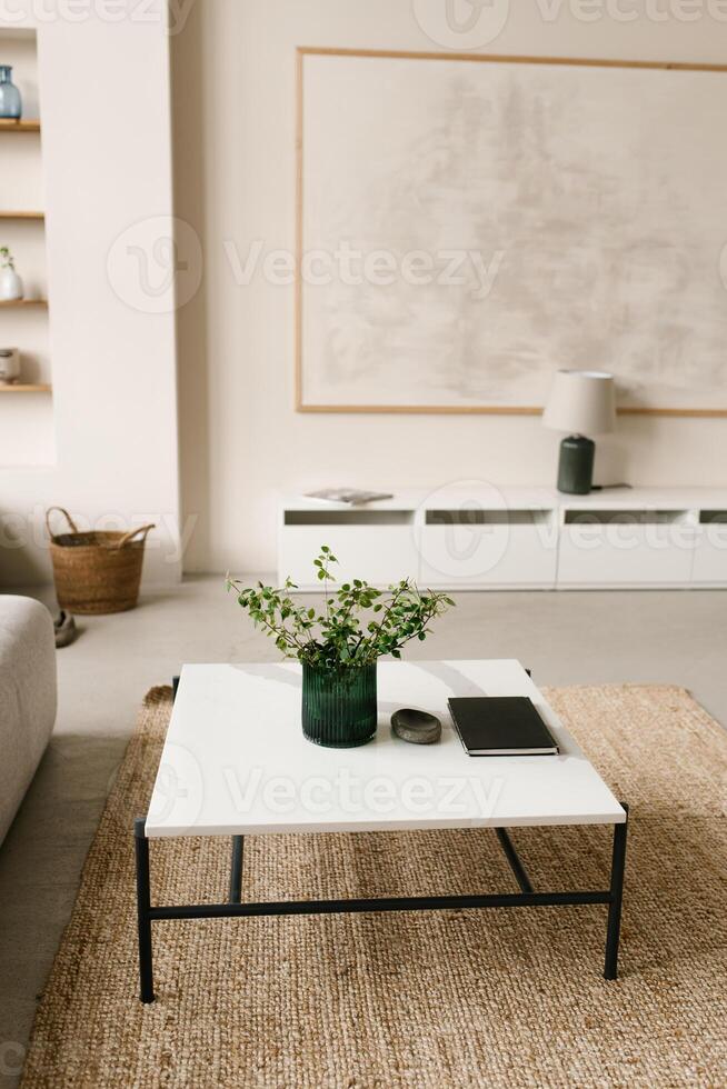 Stylish modern coffee table with metal legs and natural stone top in a bright living room decor photo