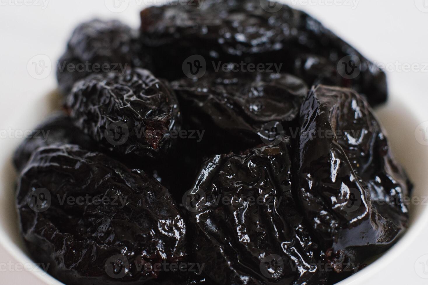 Juicy ripe prunes close-up photo