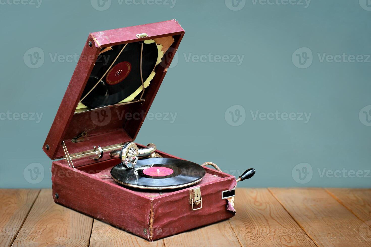 Old vintage gramophone player with a vinyl record and negative space photo