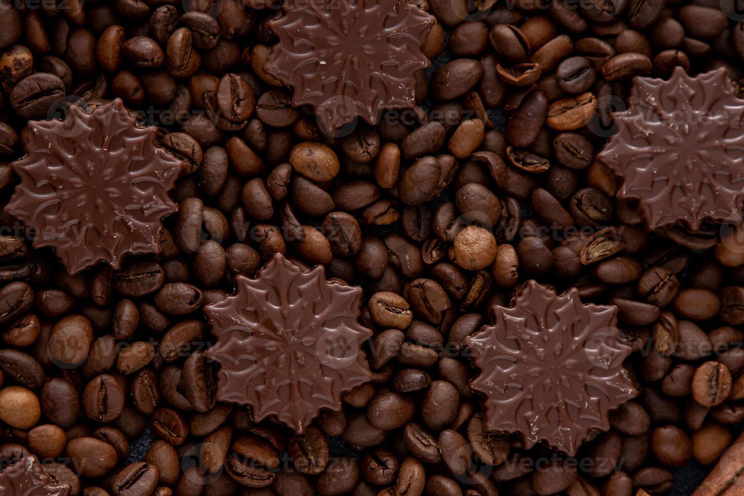 Food background. Coffee beans and chocolate candies. photo