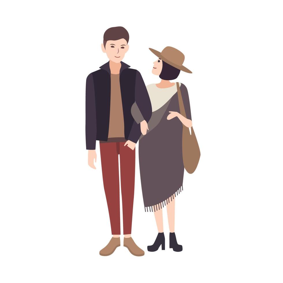Young woman wearing fashionable poncho and hat standing beside smiling man, holding his arm and warmly looking at him. Elegant teenage couple. Pair of cartoon characters. Vector illustration.