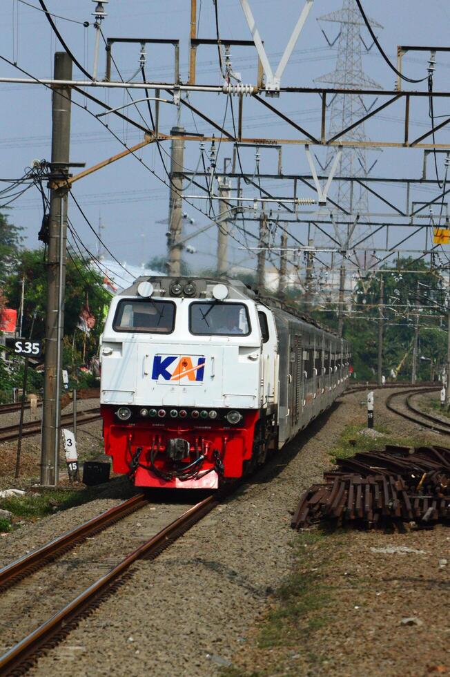 The front view of the train is waiting for passengers photo