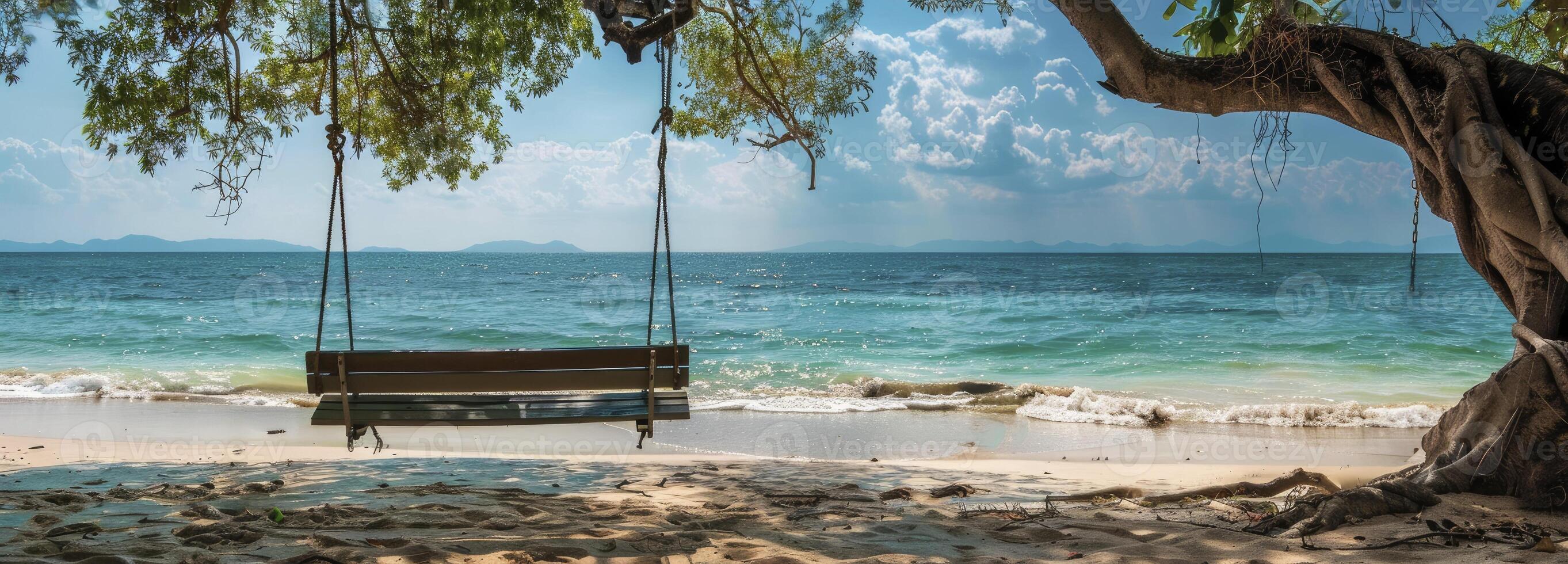 AI generated A wooden bench swing hanging from the branch of an old tree on a beach photo