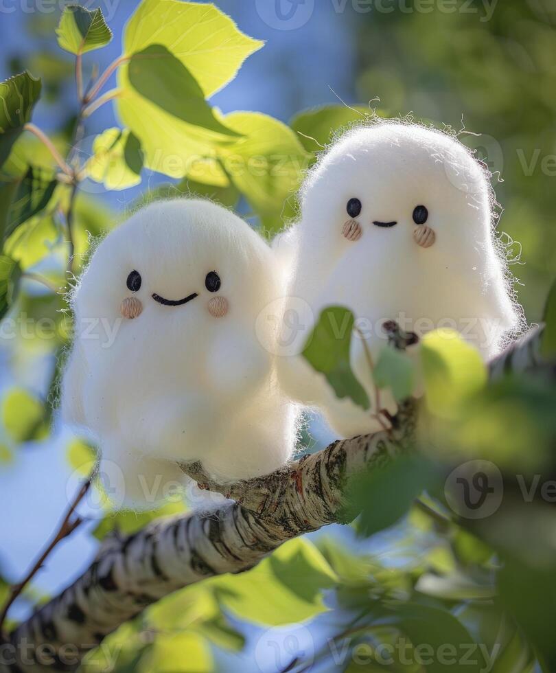 AI generated Two cute white smiling ghost dolls cotton hanging on a tree, green leaves background. photo