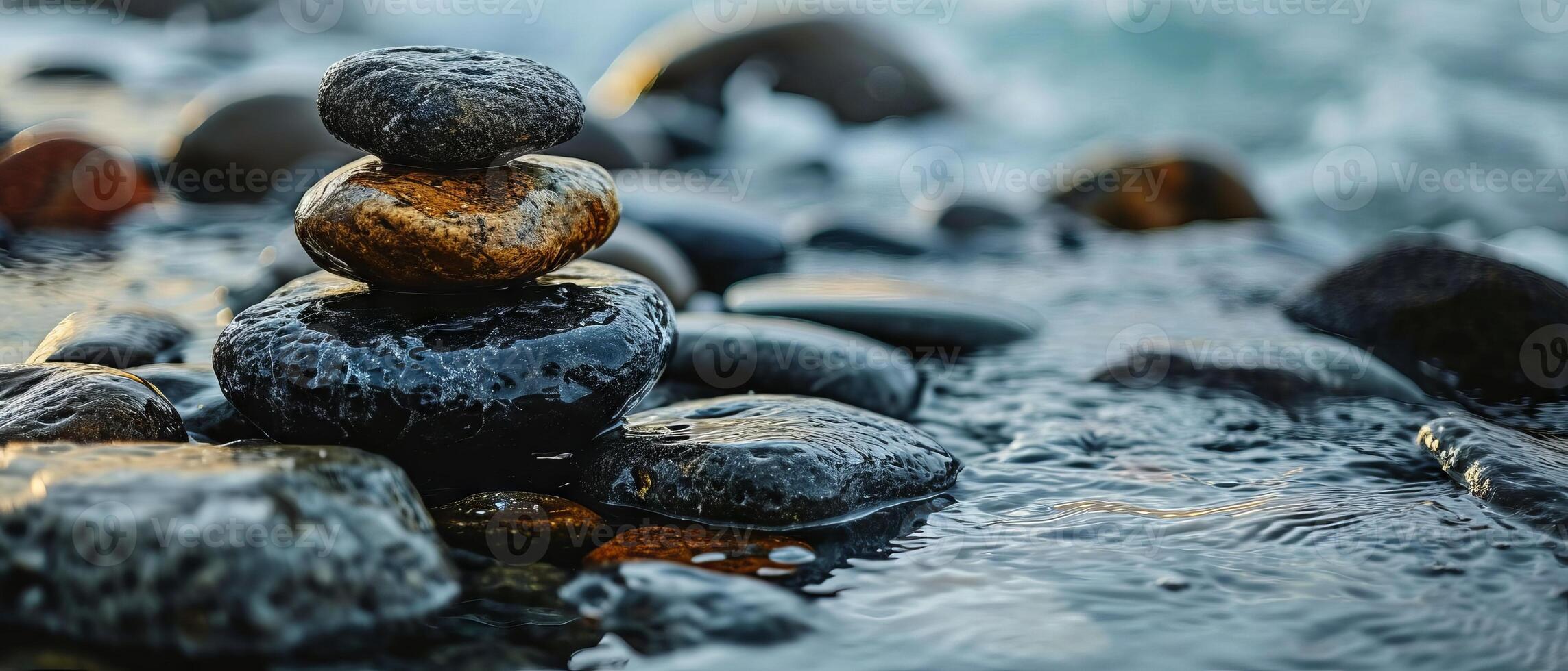 AI generated A serene composition of smoothly balanced stones at the edge of a tranquil seashore, embodying balance and calm photo