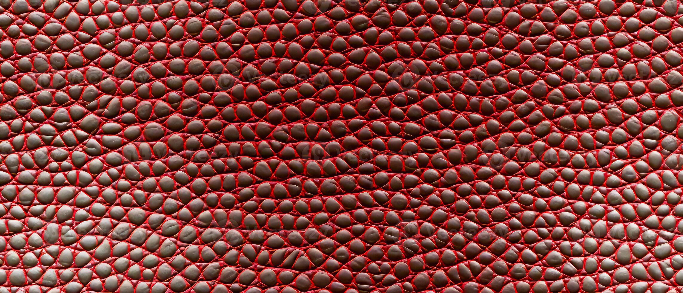 AI generated Detailed snakeskin texture in red and black, perfect for backgrounds or fashion design photo