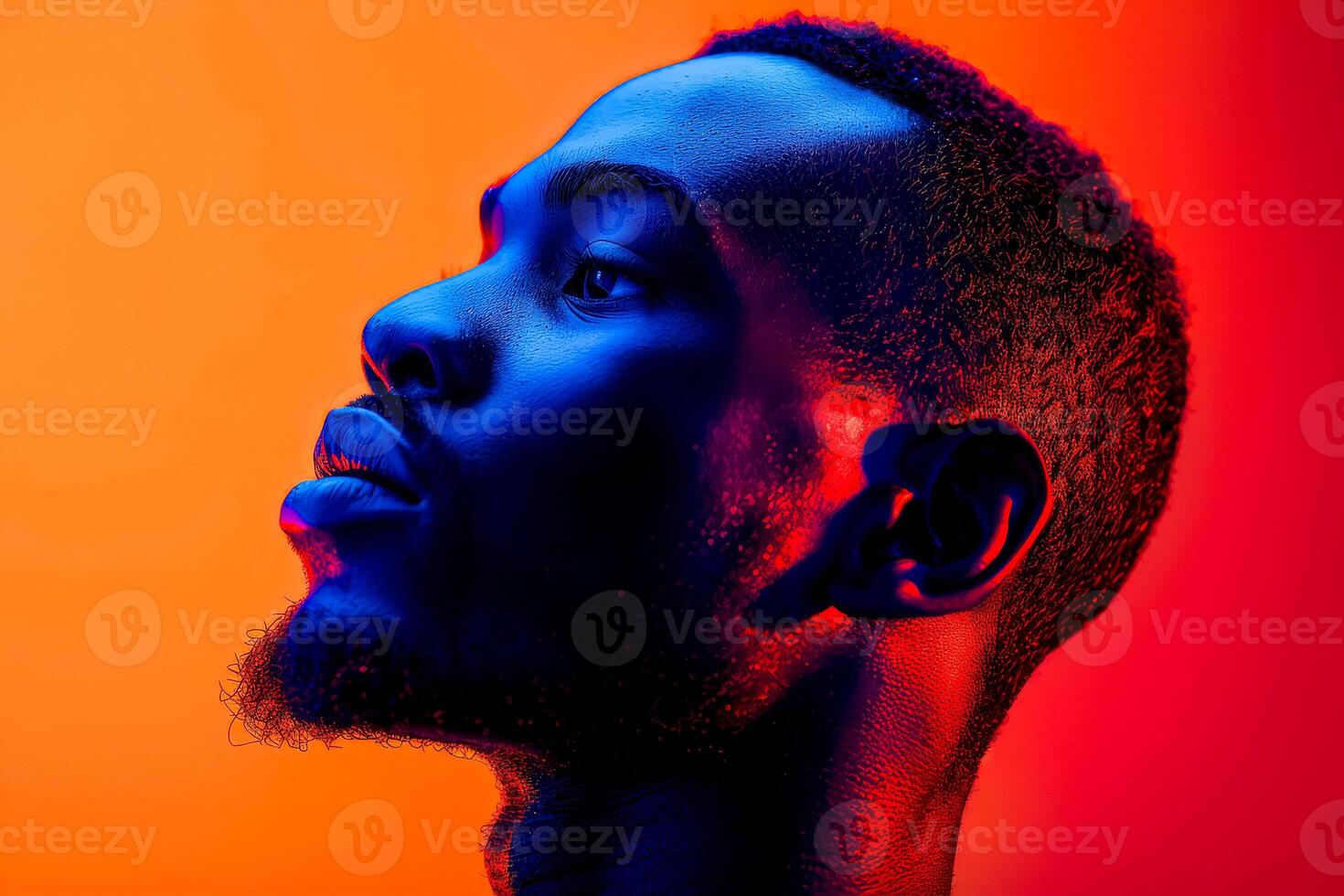 AI generated A portrait of a man lost in thought, his profile highlighted by a striking orange and blue light, creating a thoughtful mood photo