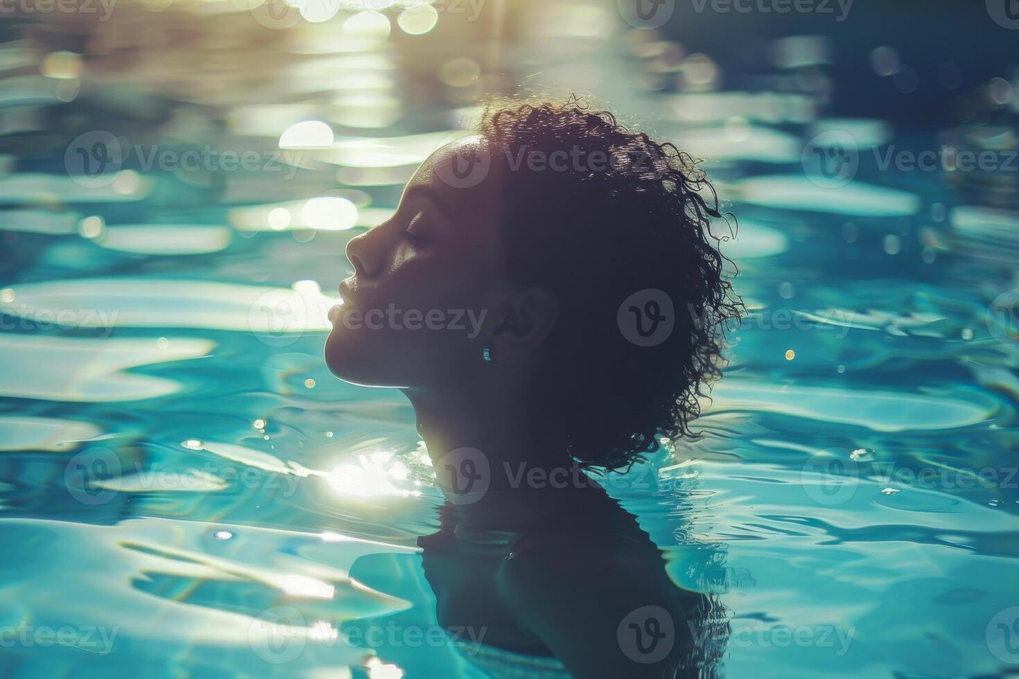 AI generated A tranquil underwater portrait capturing a person's profile with air bubbles ascending around them, bathed in the sun's rays filtering through clear blue water photo