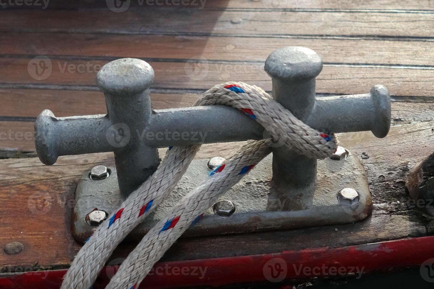 Detailed close up detail of ropes and cordage in the rigging of an old wooden vintage sailboat photo