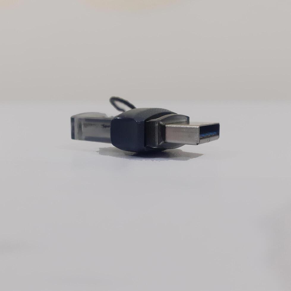 Black USB memory stick isolated on board photo