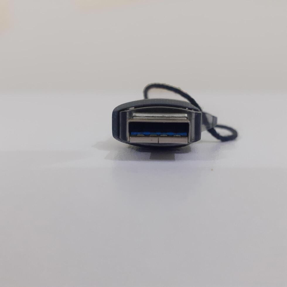 Black USB memory stick isolated on board photo