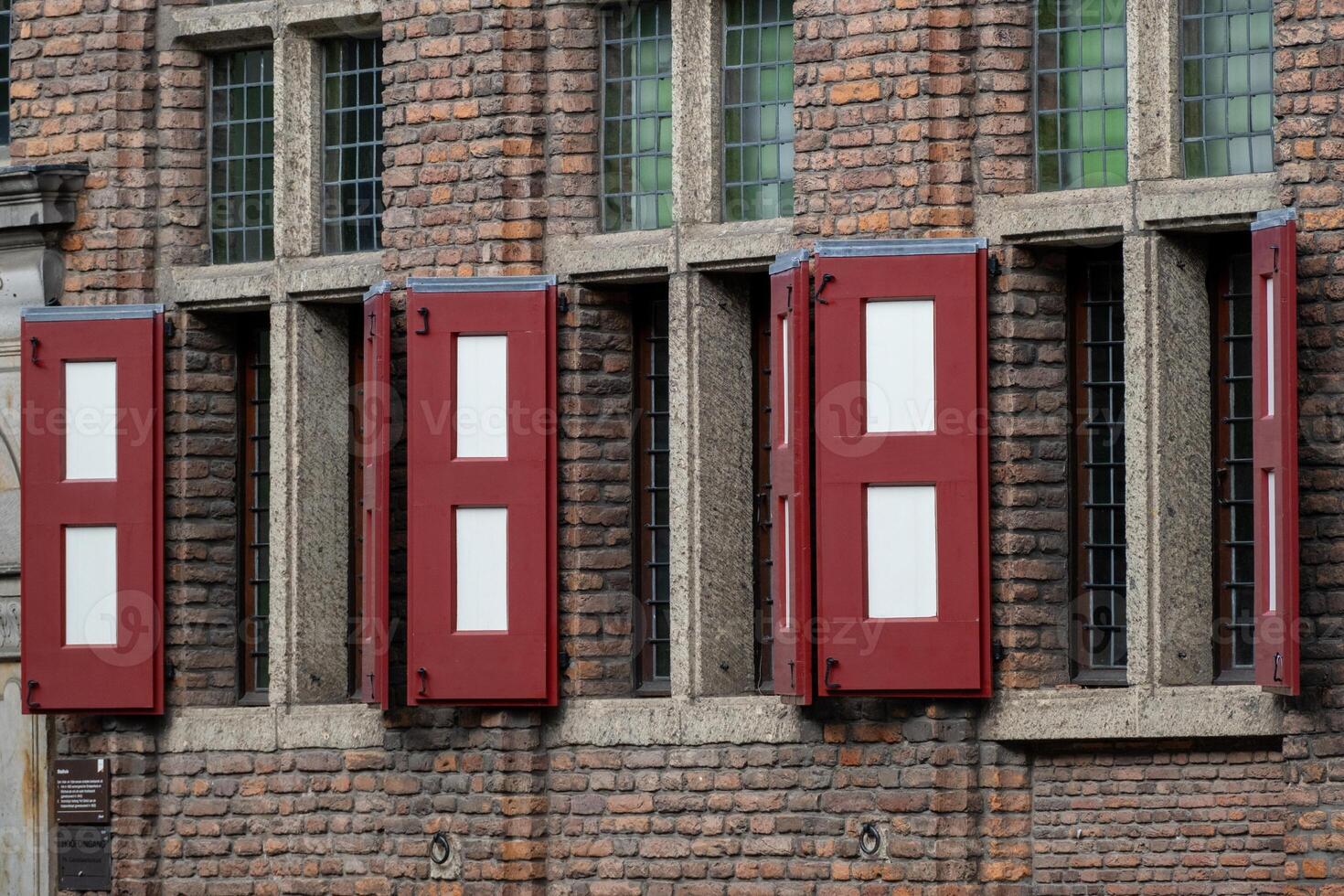 medieval house facade with windows and shutters photo