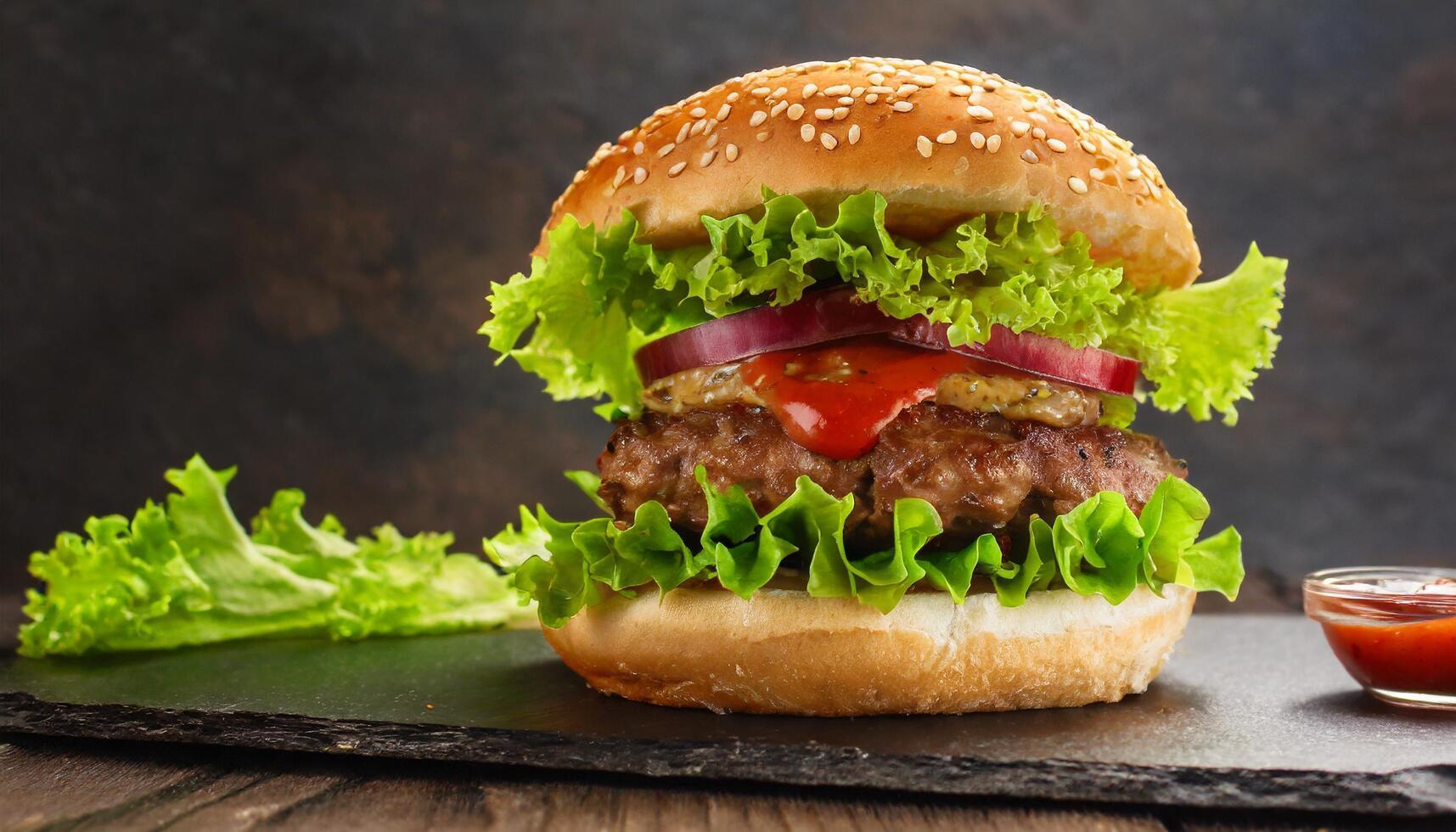 AI generated Savory burger with green lettuce, grilled beef patty and ketchup with copy space photo