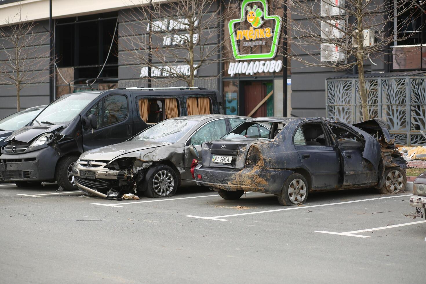 Bucha, Ukraine - April 12, 2022 Cars deliberately smashed by the russian army shooting and shelling in the streets of Bucha town photo