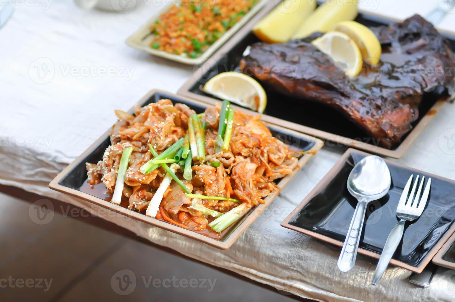 stir fried pork with chinese cabbage and kim chi and bbq or grilled pork photo