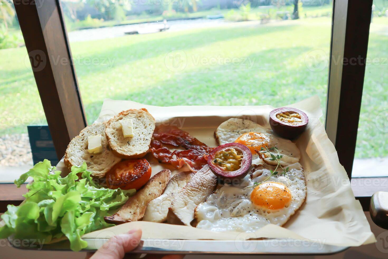 toast with bacon, fried egg and lettuce or sunny side up egg with bacon and  mushroom photo