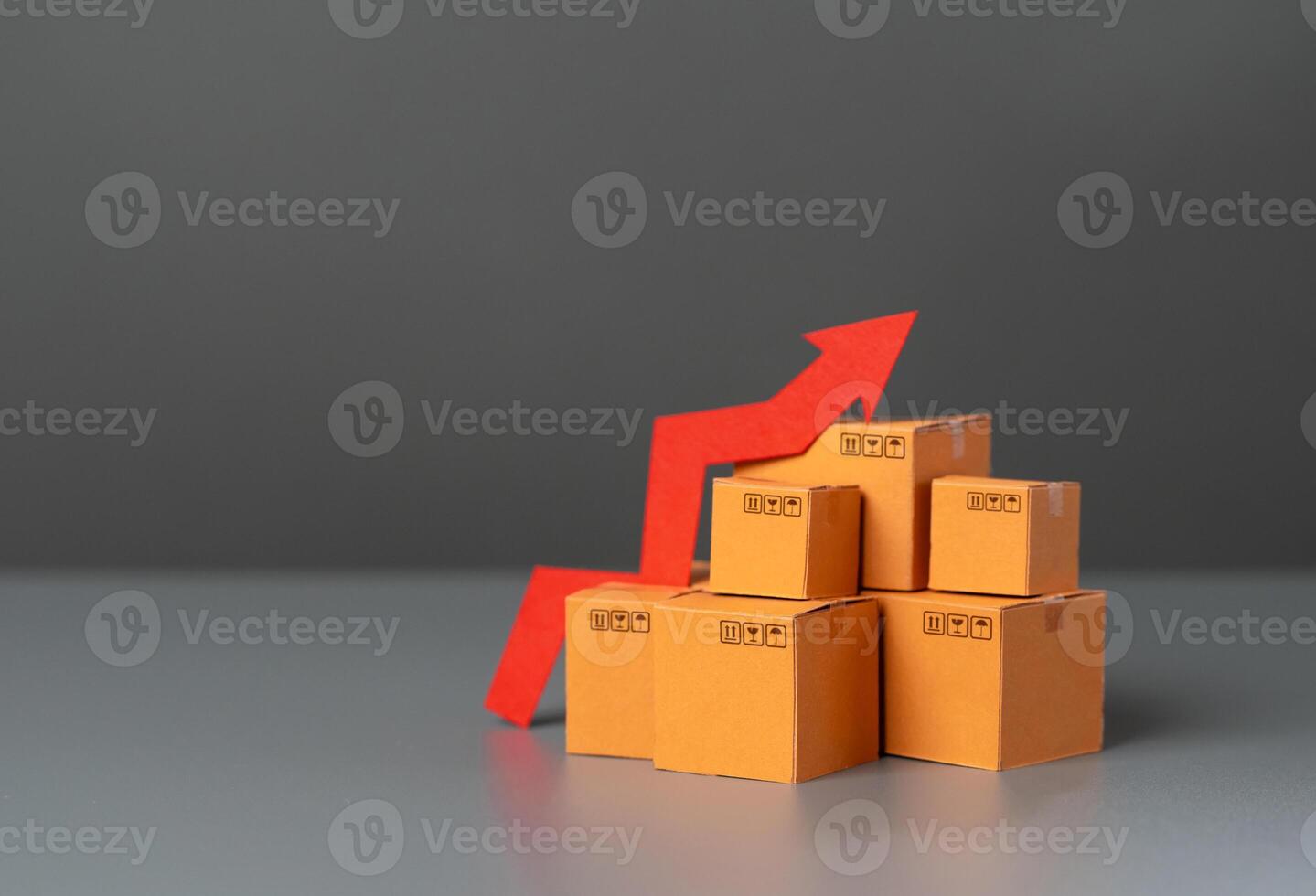 Boxes with goods and up arrow. Rising prices. Increase in supplies and production rates. Enhancement in the attractiveness of goods, high demand. Economic GDP acceleration boost. Tax increase. photo