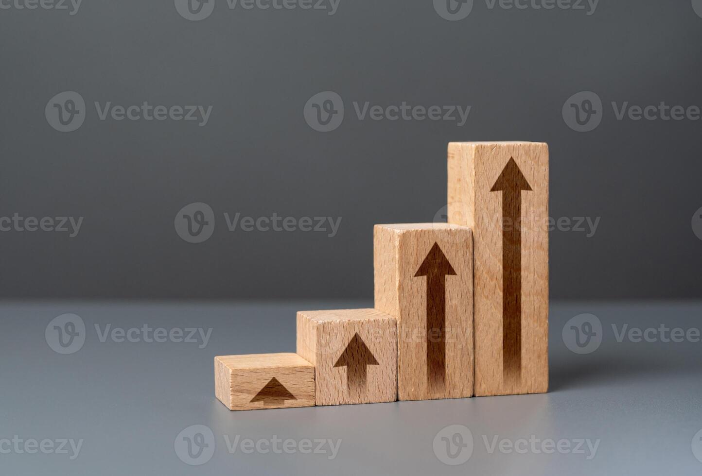 Growth chart made from wooden blocks. Growth and development, promotion. Career advancement. Achieve success and conquer new heights. Growing indicators. photo