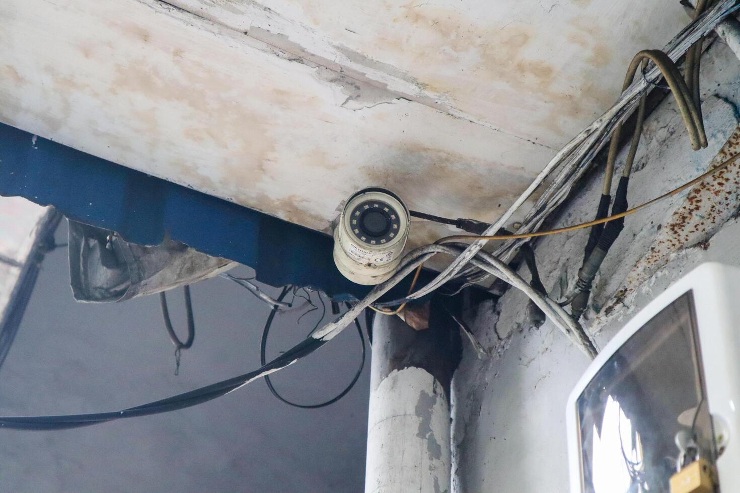 a security camera in the corner of the house. surabaya, indonesia - 6 maret 2024 photo