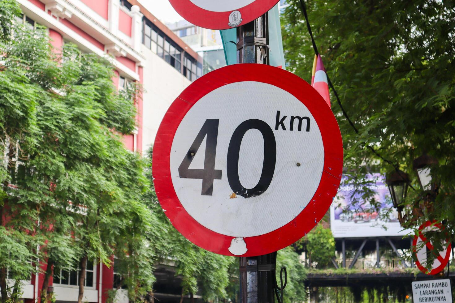 close up of speed limit sign with a speed limit of 40 km per hour. surabaya, indonesia - 21 february 2024 photo