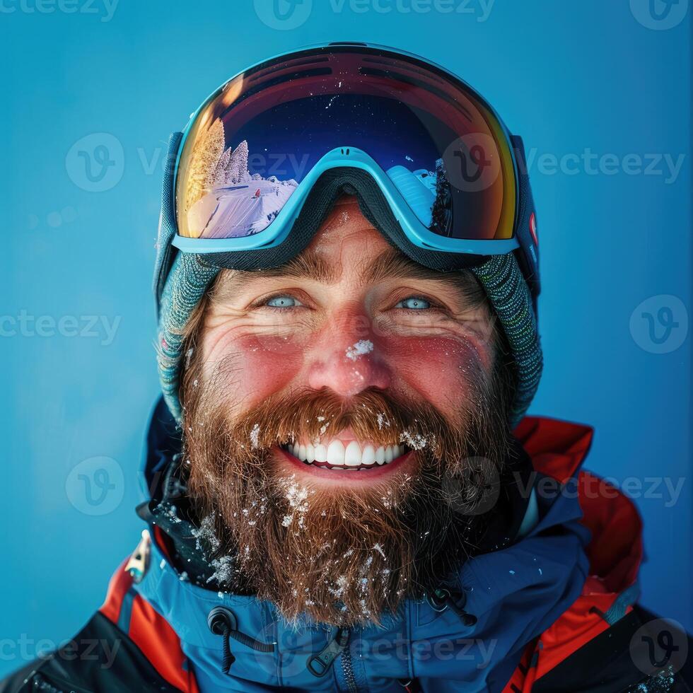 AI generated smiling man with a beard in ski equipment on a blue background photo