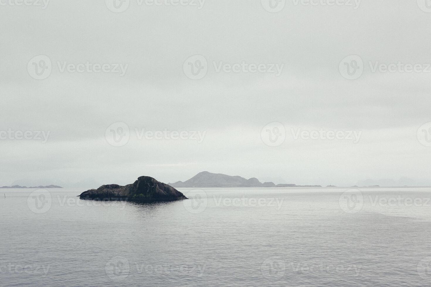 North sea with cold and snow view of the horizon and rocky coast photo