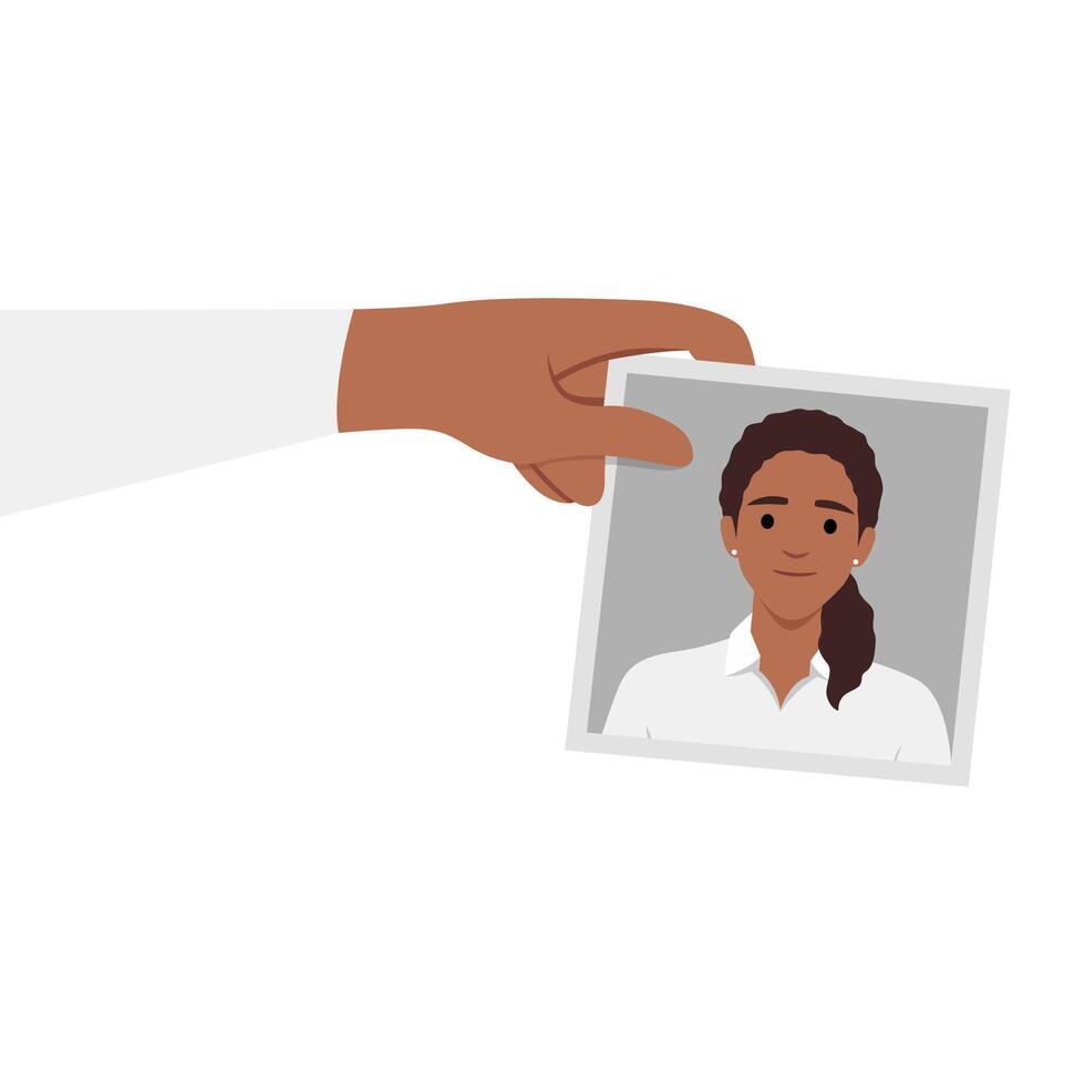 Hand holding a photo of a woman smiling. vector