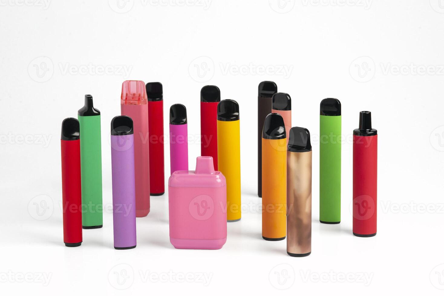 Set of colorful disposable electronic cigarettes of different shapes on a white background. The concept of modern smoking. photo