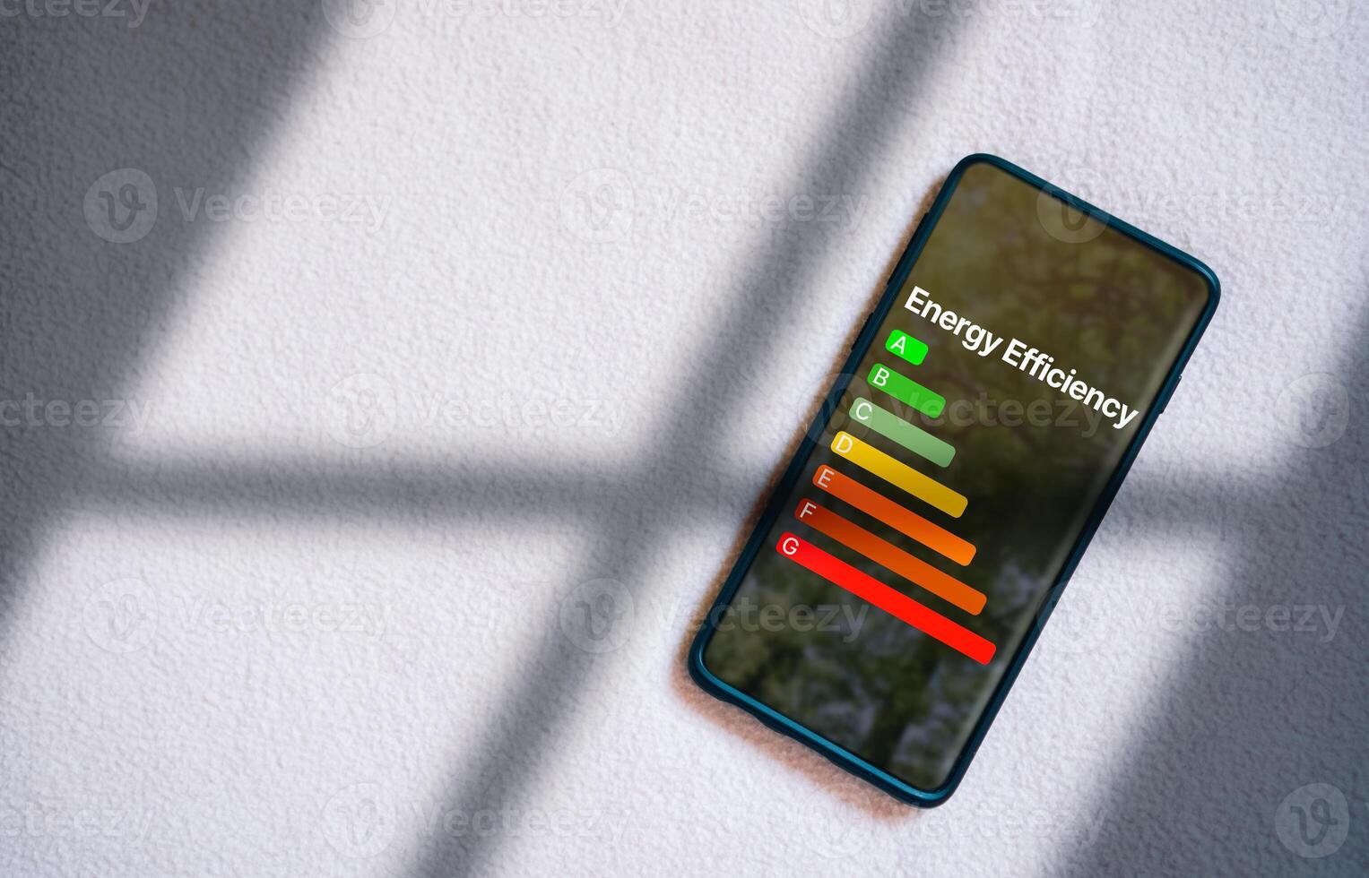 Smartphone screening interface of rate energy efficiency and eco home renovation. Low consumption ecological house, sustainable development concept. photo