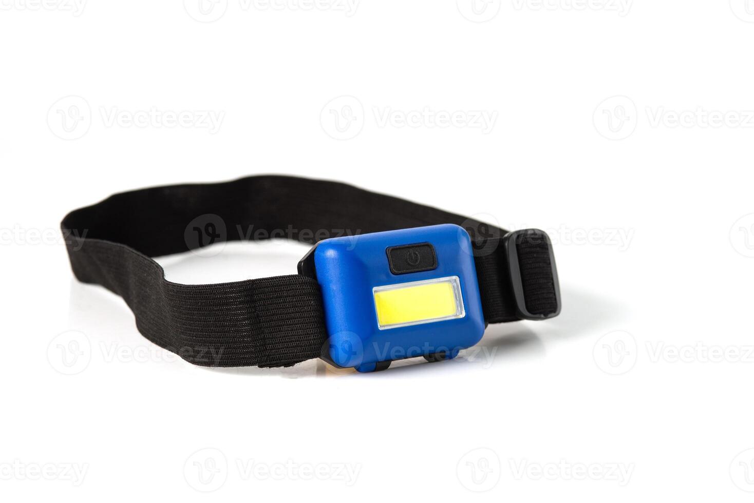 Head Torch flashlight on white background isolation. Light battery operated lamp worn on head. photo