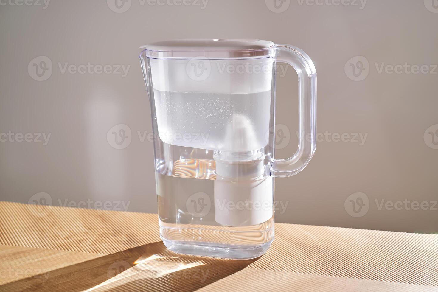 Jug with water filter in the interior. photo