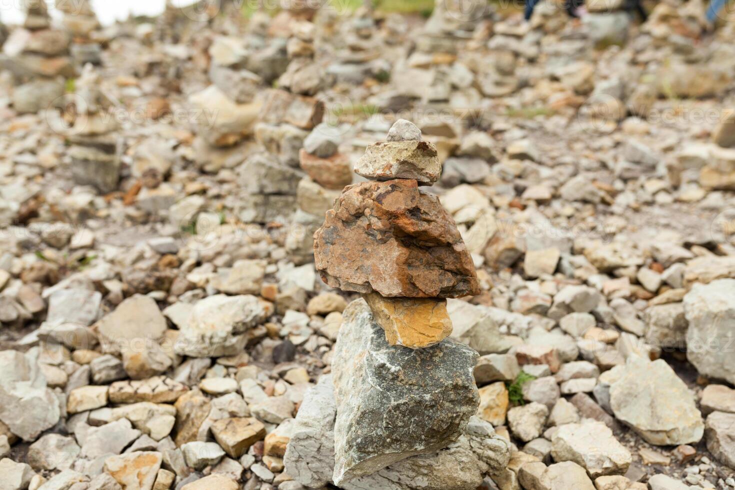 Stones stacked one on the other. Instalation near the Memorial naval aviation Cape of the Goat, France photo