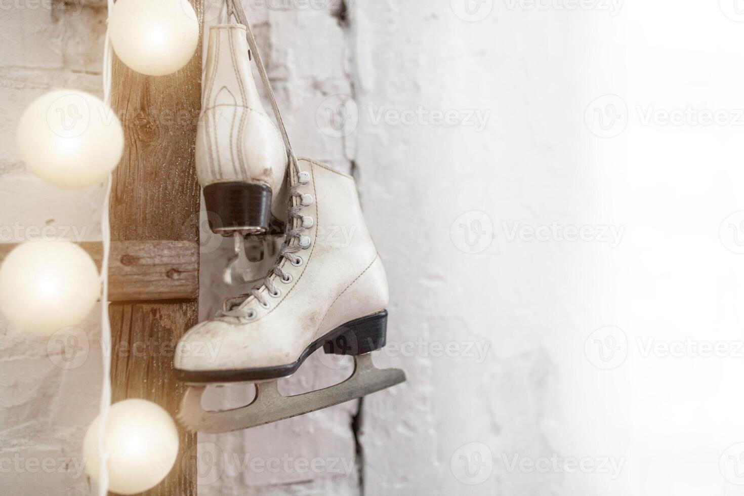 White skates at the wooden staircase. New year interior photo