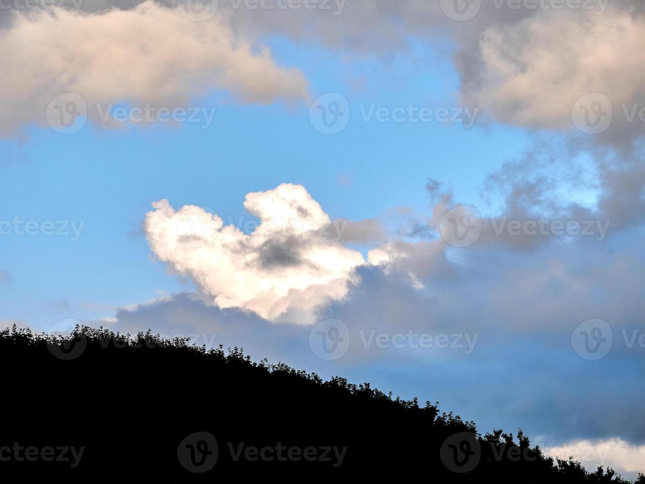 White fluffy clouds in the deep blue sky. Heaven background photo